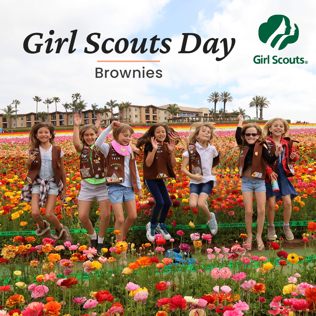 Girls jumping amidst many flowers at the Flower Fields Carlsbad