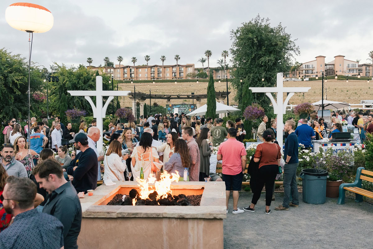 Many people chatting at The Flower Fields Carlsbad during a corporate event.